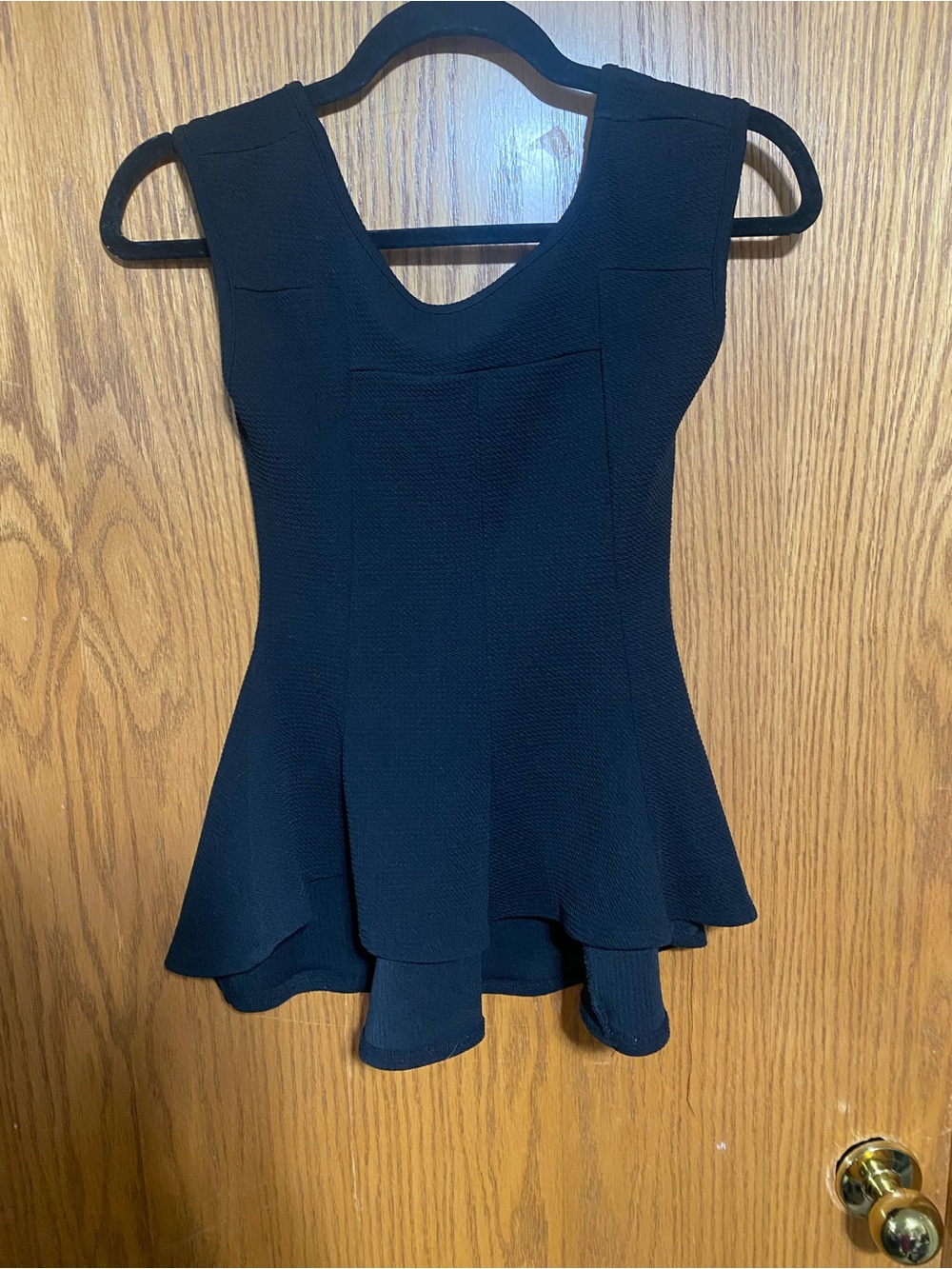 Black Sleeveless Peplum Top